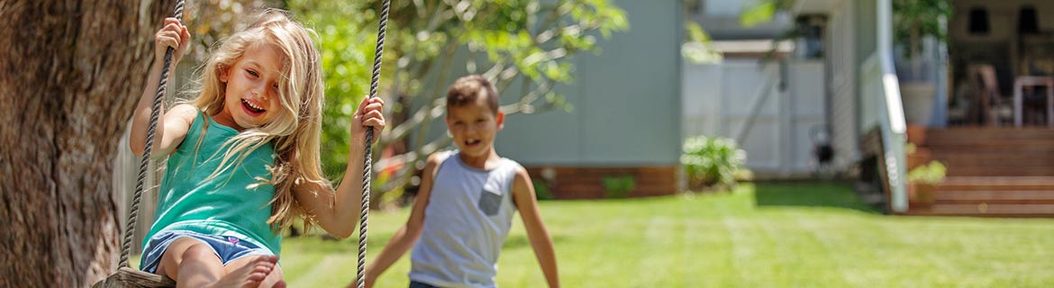 Kids on backyard swing