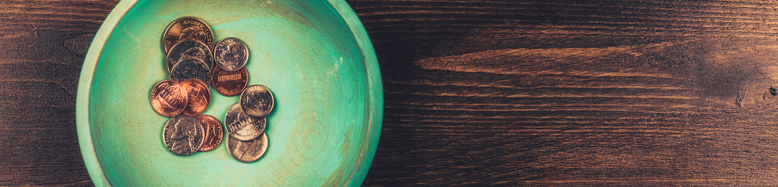 Coins in teal dish