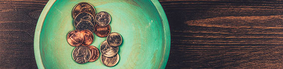 Coins in teal dish.